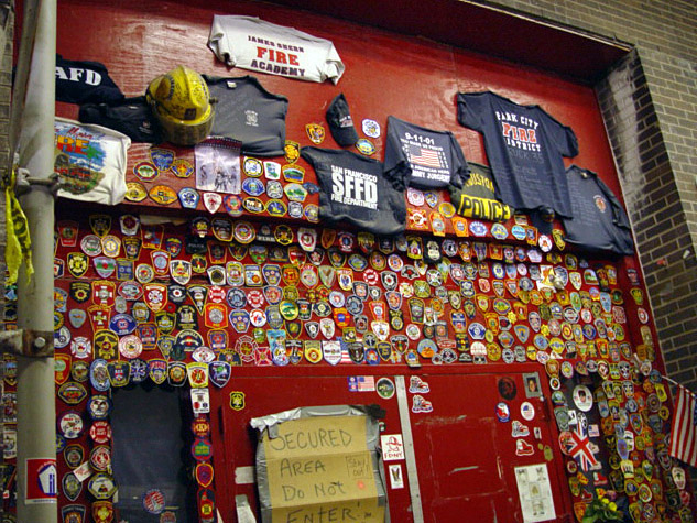 Photo by Pete Burke. FDNY on Liberty Street with shirts and patches from fire departments all over the world, truly a brotherhood.  © Pete Burke