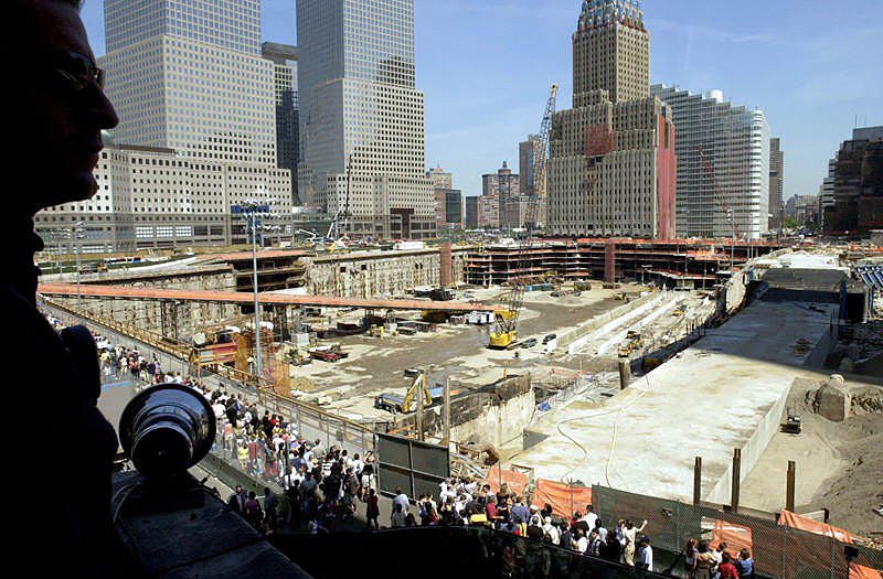 A Ladder 10 Company firefighter views ground zero from the roof of the damaged 10 Firehouse. The firehouse, located across the street from the World Trade Center, was badly damaged due to the attacks on September 11th, 2001  Photo by Mike De Sisti 8/10/02 © 2002 Appleton Post-Crescent