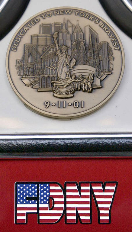 A plaque on the front of The Seagrave produced Ladder 10 truck.  Photo by Mike De Sisti 8/9/02 © 2002 Appleton Post-Crescent
