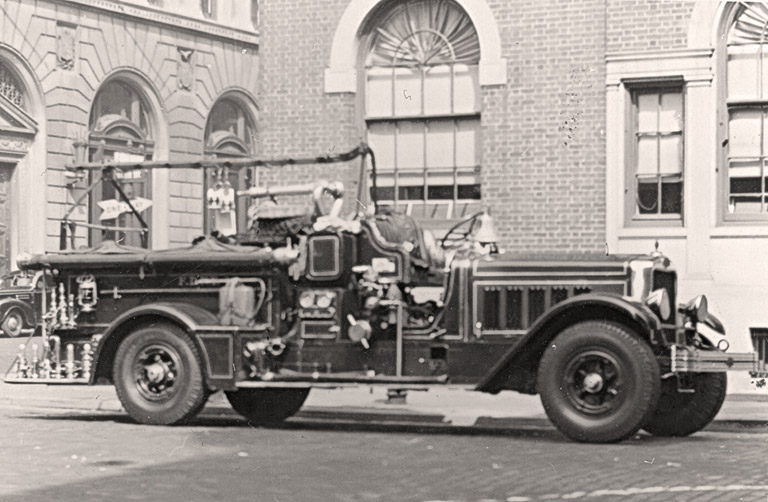 1931 American LaFrance 700 Gallon Pumper. New York.Rig is parked in the street. Photo FDNY George F. Mand Library