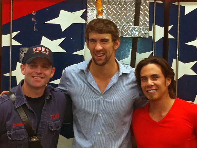Michael Fred Phelps (center) is an American swimmer who has, overall, won 16 Olympic medals.  Apolo Anton Ohno (right) is an American short track speed skating competitor, the most decorated American Winter Olympic athlete of all time.