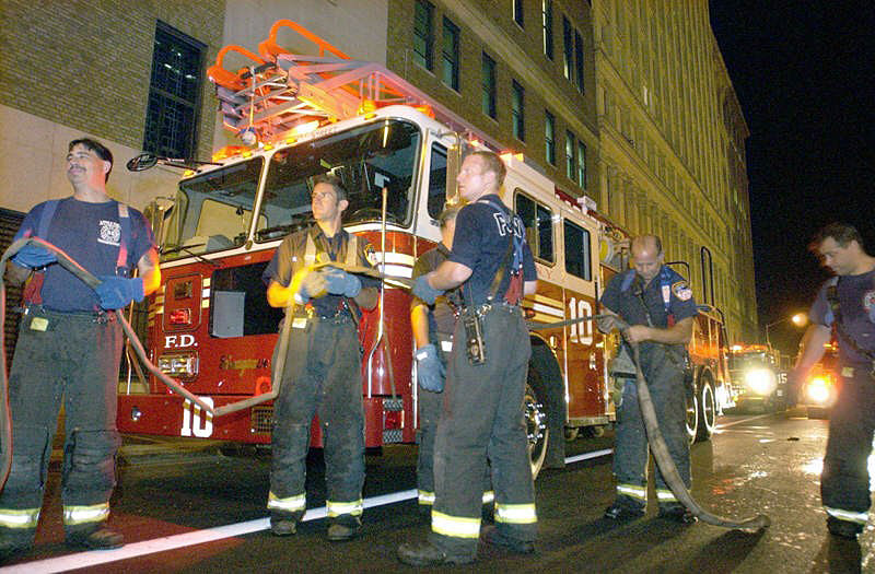 Ladder 10 and other area firefighters respond to a minor garage fire in Manhattan's financial district.  Photo by Mike De Sisti 8/7/02 © 2002 Appleton Post-Crescent